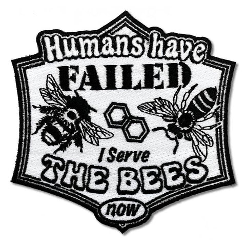 Patch with text 'Humans have failed, I serve the bees now' featuring bee illustrations on a white background.