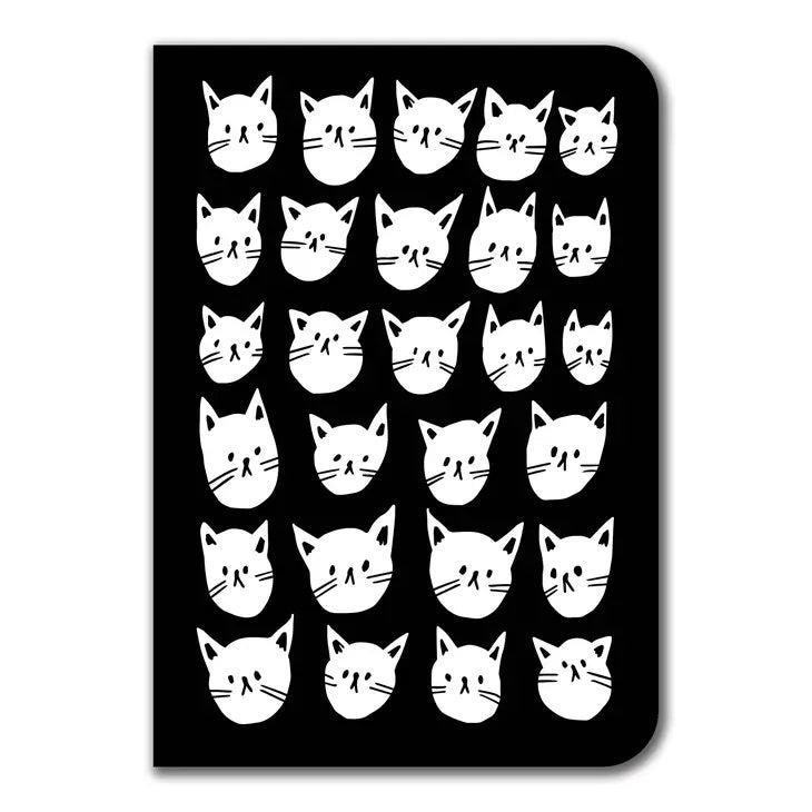 black notebook with many white cat faces on it