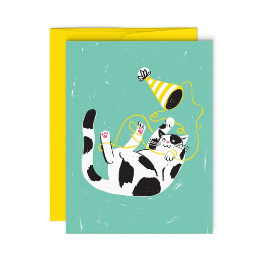 Cat playing with party hat card.