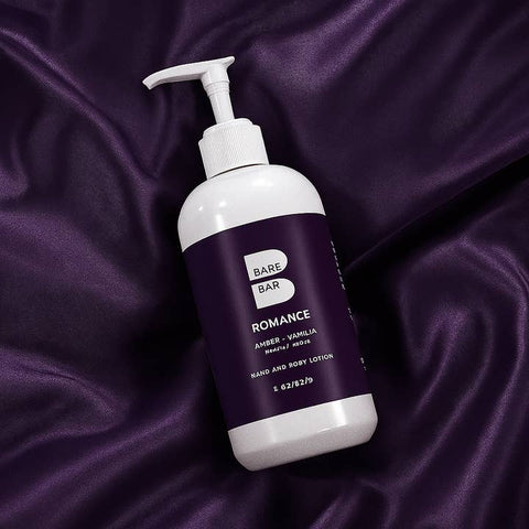 Bare Skin Bar Romance lotion bottle on purple satin fabric