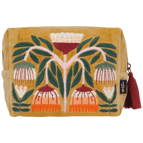 Decorative pouch with floral design on a mustard background