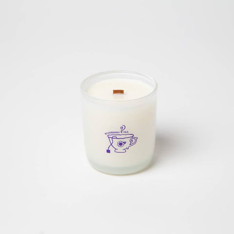 Candle in a glass jar with a logo on a white background