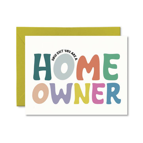 Greeting card with colorful text 'HOME OWNER' and green envelope on white background