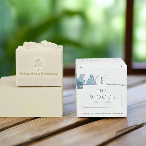 Tofino Soap Company soap bar and packaging on a wooden surface with a blurred natural background