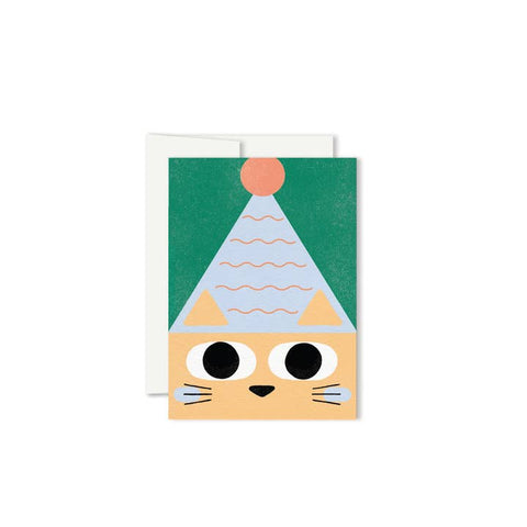 Greeting card with a cat face design on a green background