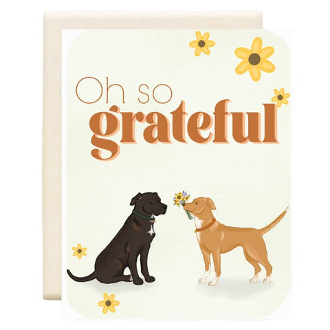 Greeting card with two dogs and the text 'Oh so grateful' on a white background