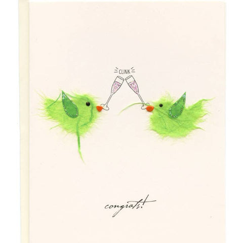 Two green birds clinking champagne glasses with 'congrats!' text on a beige background