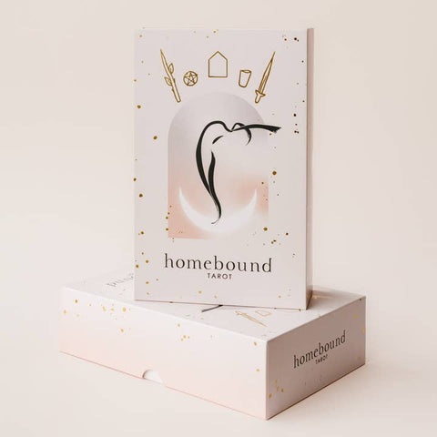 Homebound Tarot card packaging with tarot card illustration on a light background