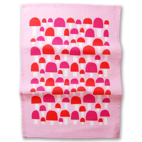 Pink fabric with red and pink geometric pattern on a white background