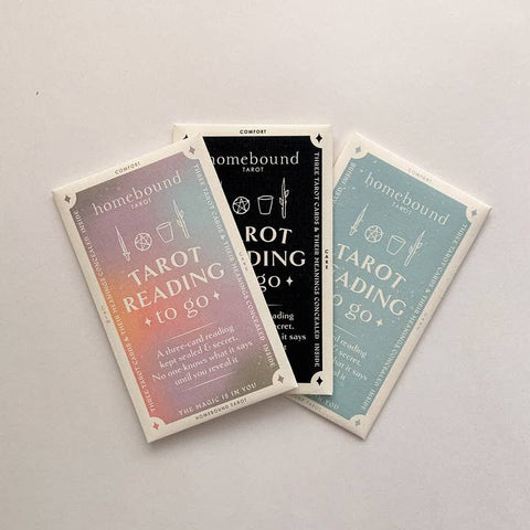 Three tarot cards from the 'Homebound Tarot' set on a light gray background.