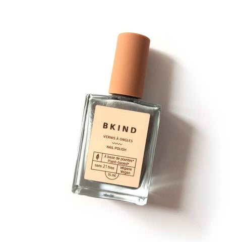 BKind nail polish bottle with a beige cap on a white background