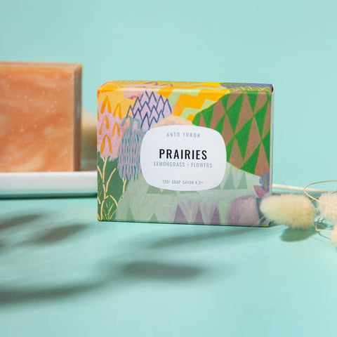 Colorful soap bar with 'Prairies' label on a light blue background