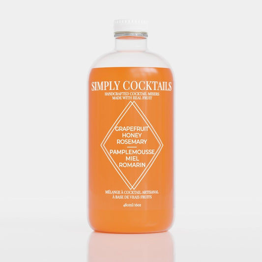 Grapefruit Rosemary Cocktail Mix in large glass bottle
