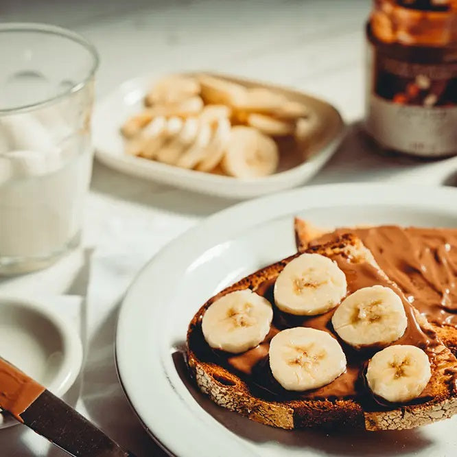 Chocolate and Hazelnut Cream Spread on toast with bananas