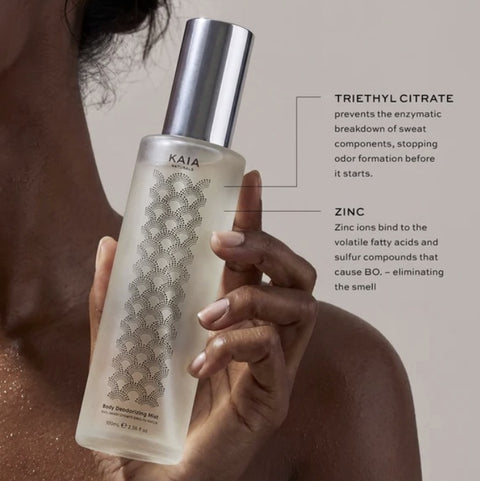 Applying Kaia Naturals Body Refresh alcohol-free body mist
