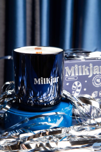 milk jar peppermint candle in blue vessel with tinsel 