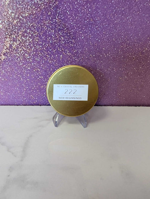Gold circular object on a stand with a purple glittery background