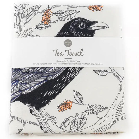 white tea towel with raven sitting in tree