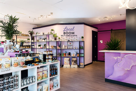 Store interior with 'Local BOOM' branding and product displays.