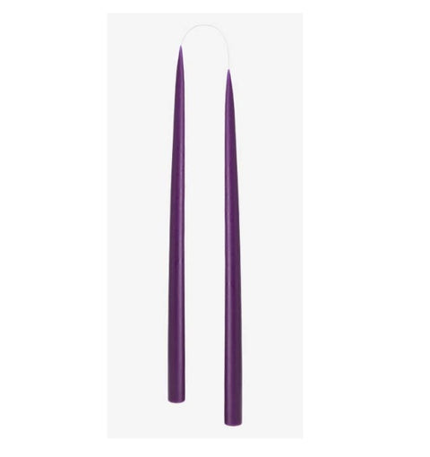 Two long, thin purple taper candles standing upright side by side on a plain white background.